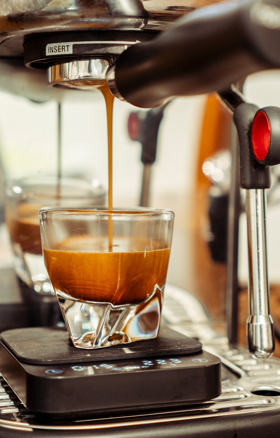Two streams of fresh espresso falling into a glass