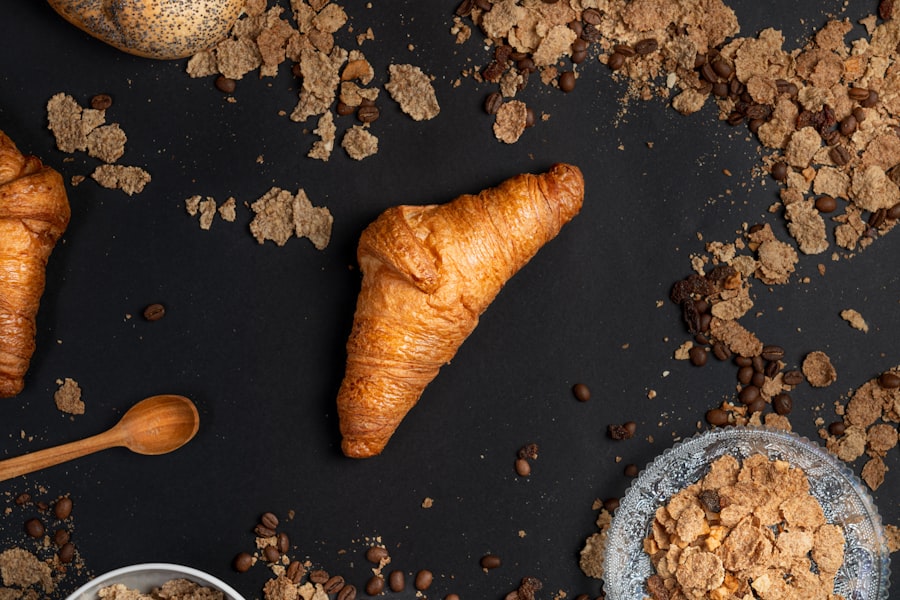 Flaky pastries arranged beside grains on the bakehouse counter